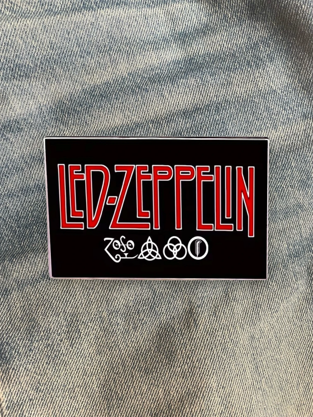 WILDSIDE Led Zeppelin band logo pin with red lettering and four symbols on a black background.