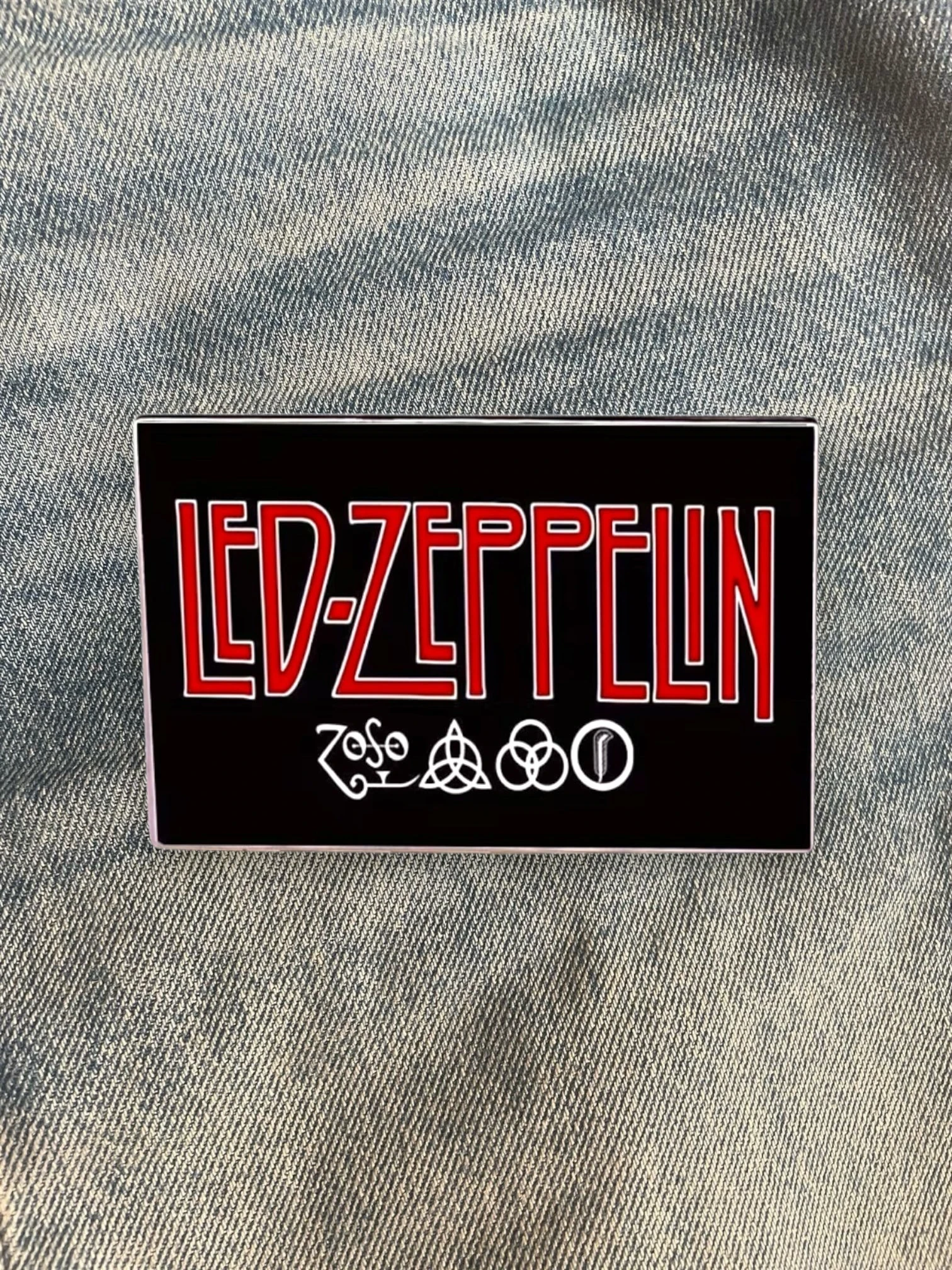 WILDSIDE Led Zeppelin band logo pin with red lettering and four symbols on a black background.