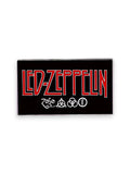 WILDSIDE Led Zeppelin rectangular pin with red lettering and four symbols on a black background.