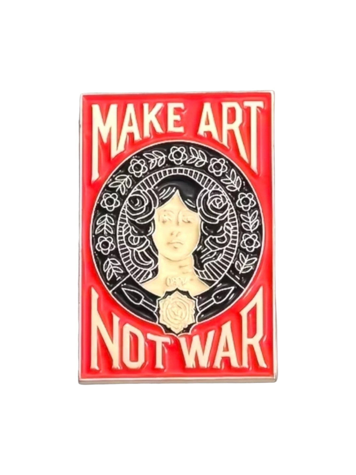 WILDSIDE Make Art Not War enamel pin with a portrait of a woman surrounded by floral elements.