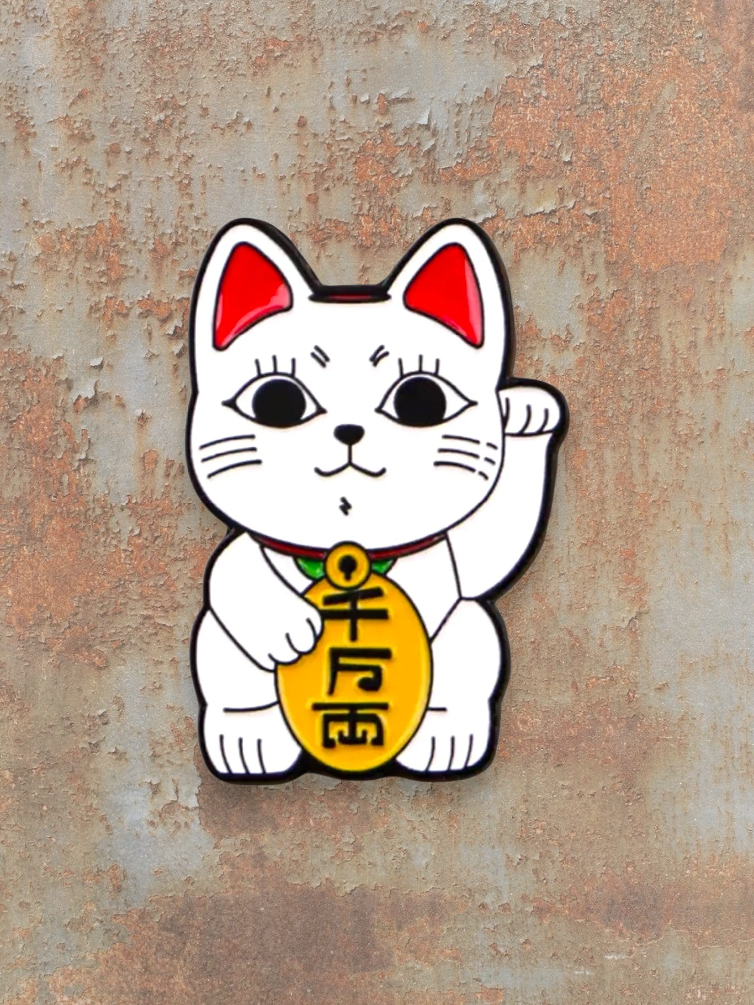 WILDSIDE white enamel Maneki Neko cat pin with red ears and a gold coin.