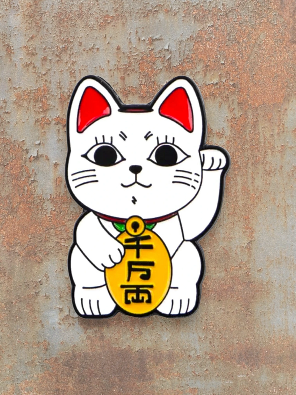 WILDSIDE white maneki-neko cat pin with red ears and a gold coin.