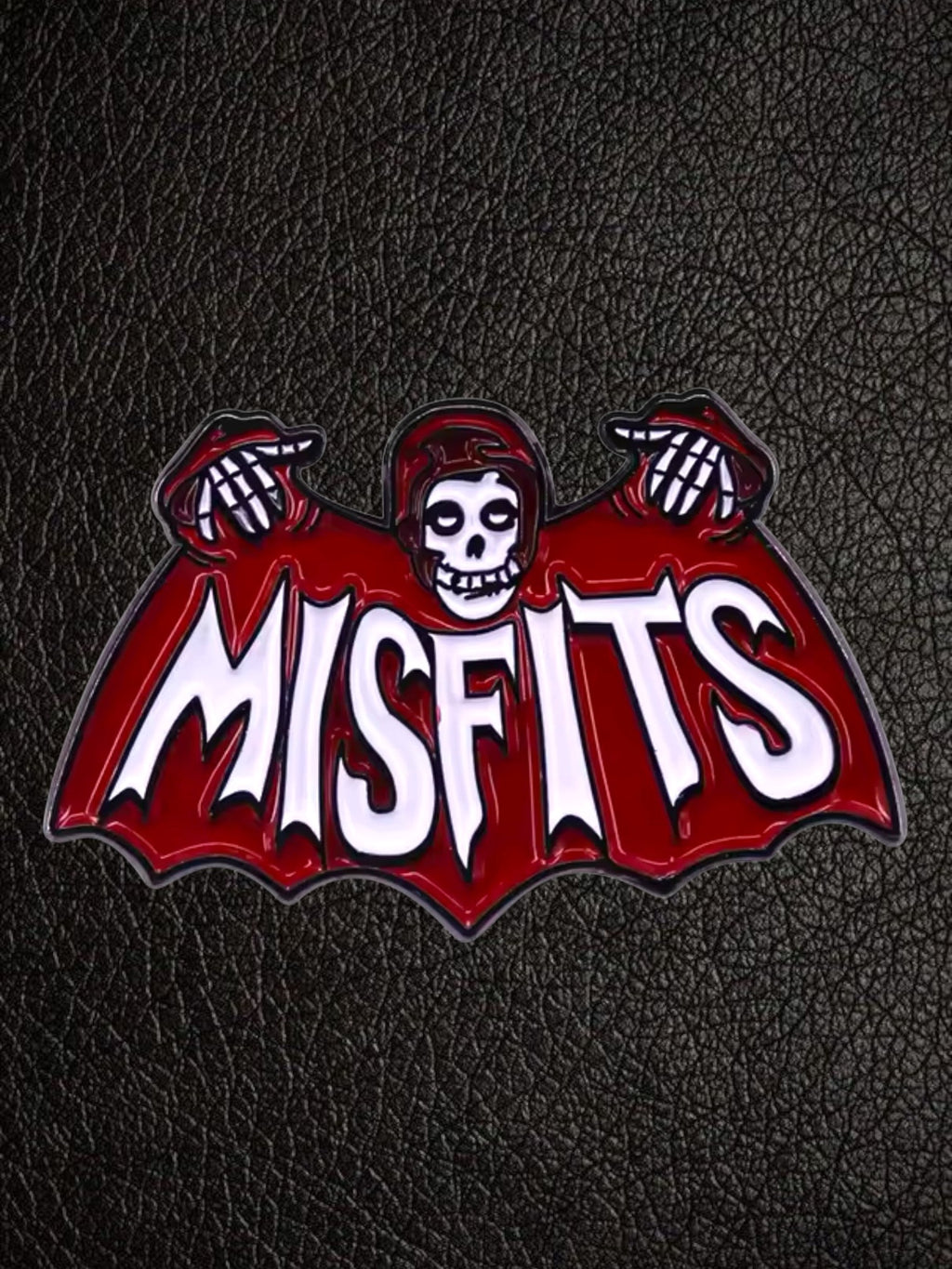 WILDSIDE Misfits Fiend skull logo enamel pin, red and white with black details.