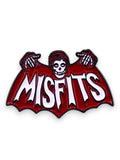 WILDSIDE Misfits Fiend skull logo enamel pin, red and white with black details.