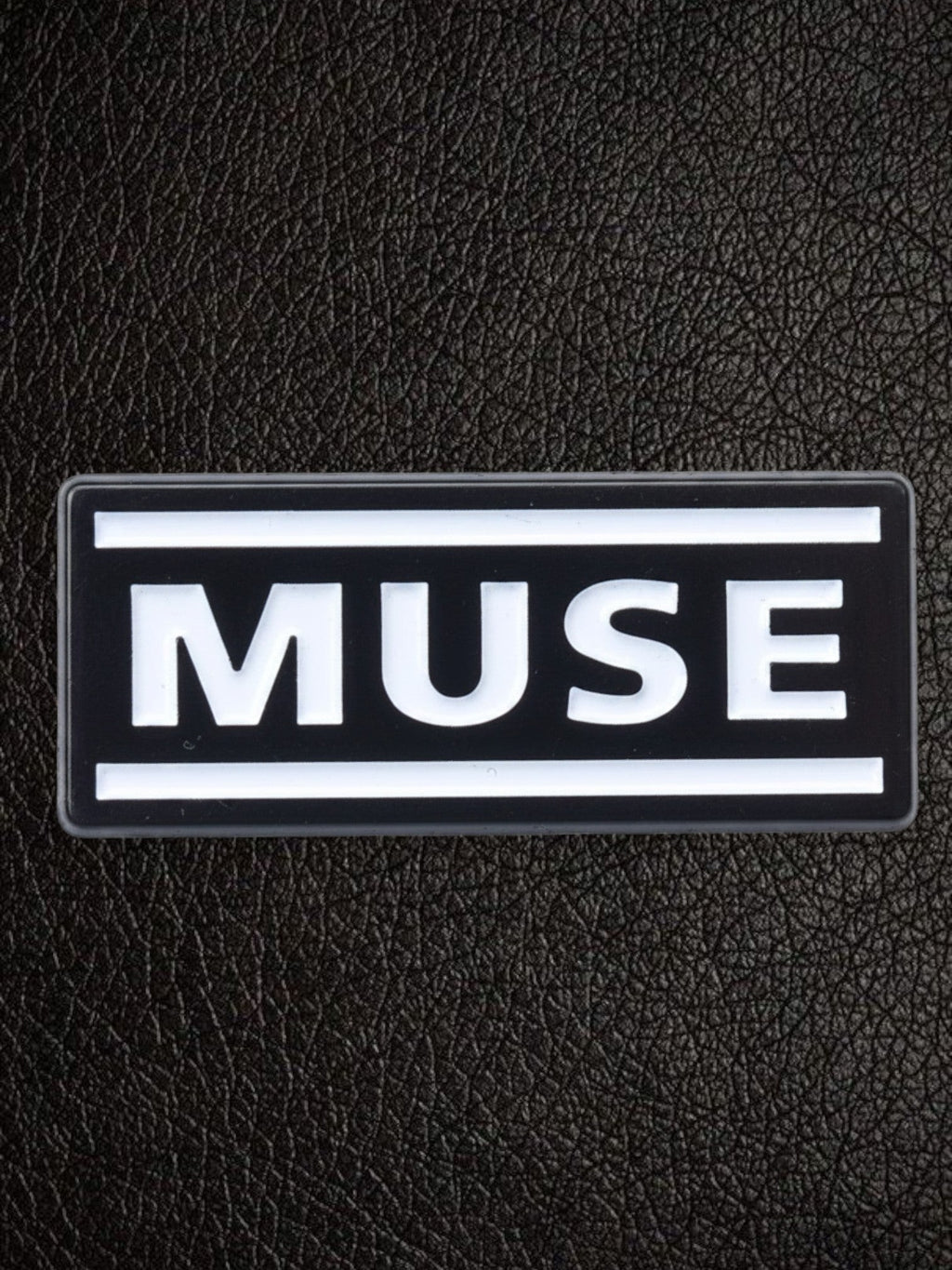 WILDSIDE black rectangular pin with white 'MUSE' text and white border.