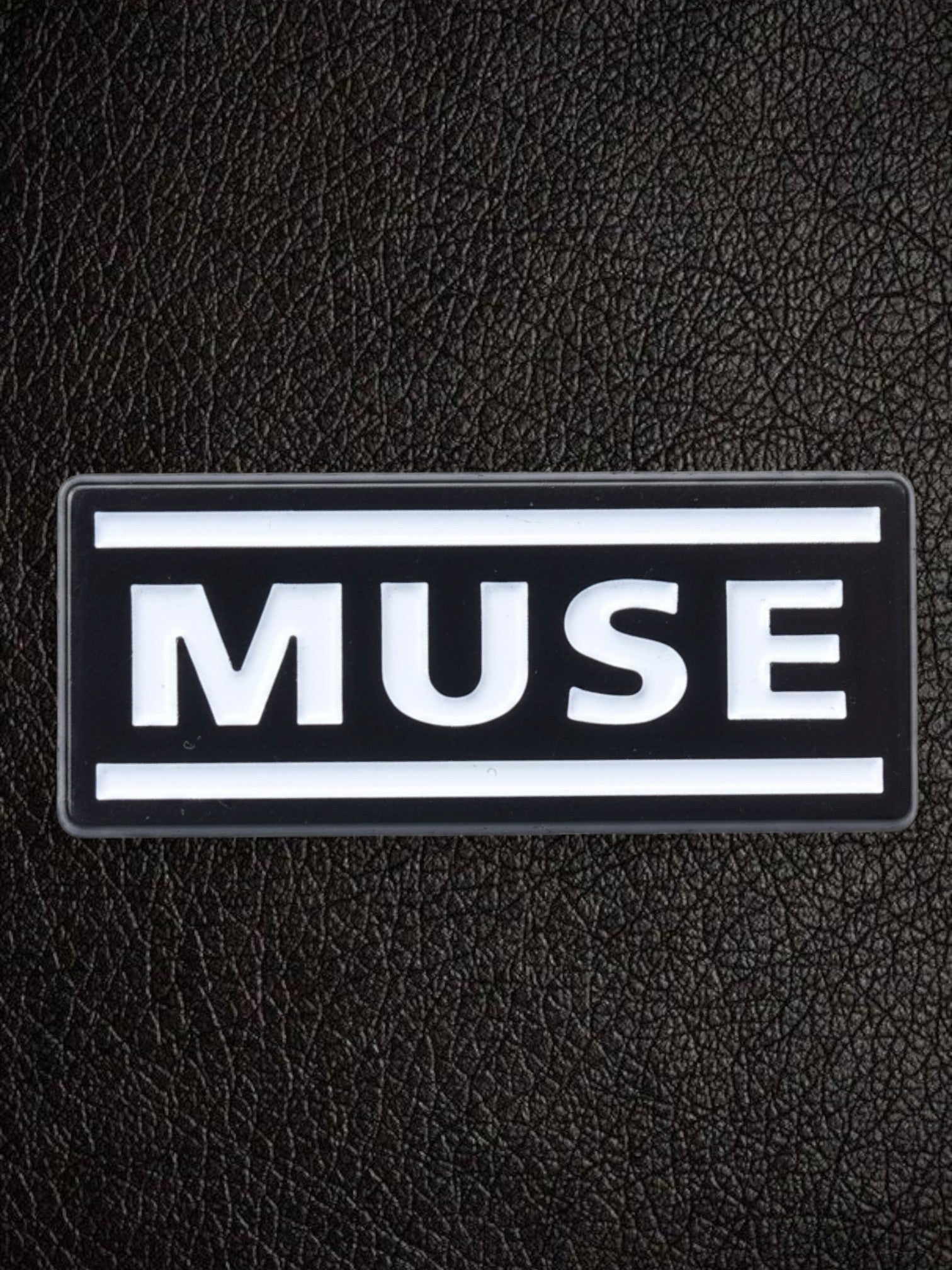 WILDSIDE black rectangular pin with white 'MUSE' text and white border.