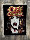 WILDSIDE Ozzy Osbourne back patch with embroidered red and yellow logo and iconic portrait with fangs.