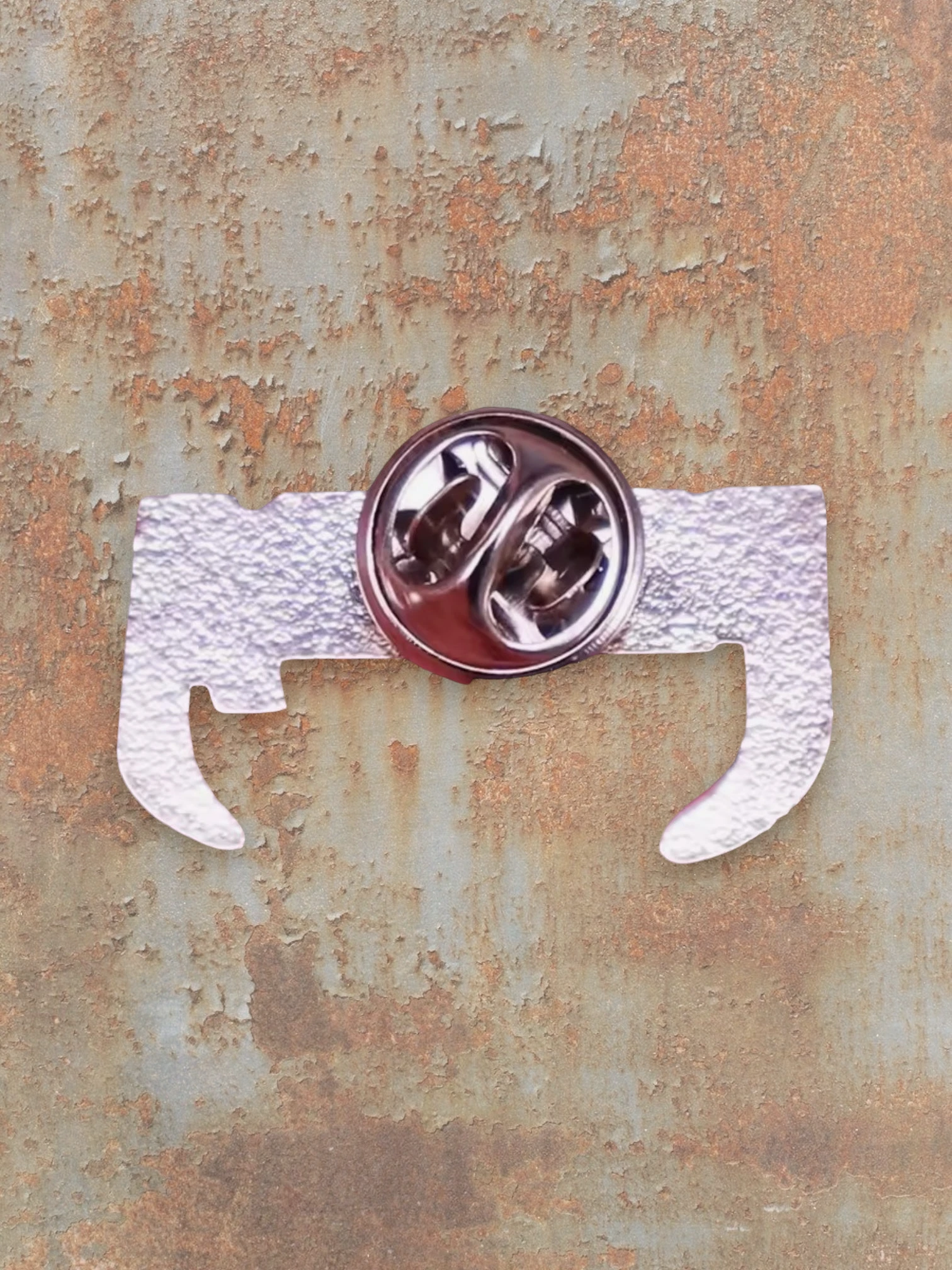 WILDSIDE Pantera pin, silver metal quotation mark design with clutch back.