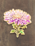 WILDSIDE pink and purple chrysanthemum flower pin with green leaves and gold trim.