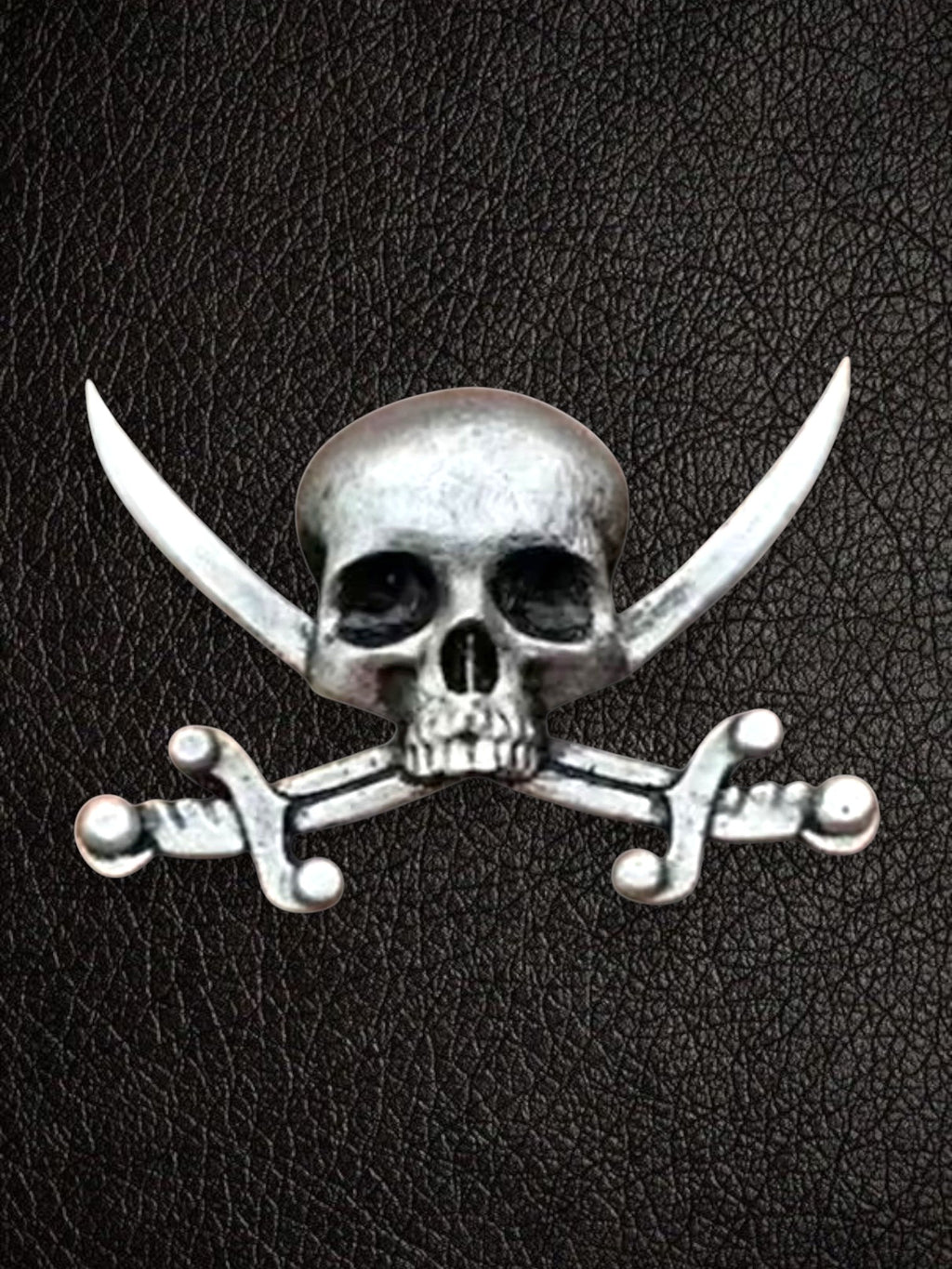 WILDSIDE silver metal pirate skull and crossbones pin with detailed skull and curved swords.