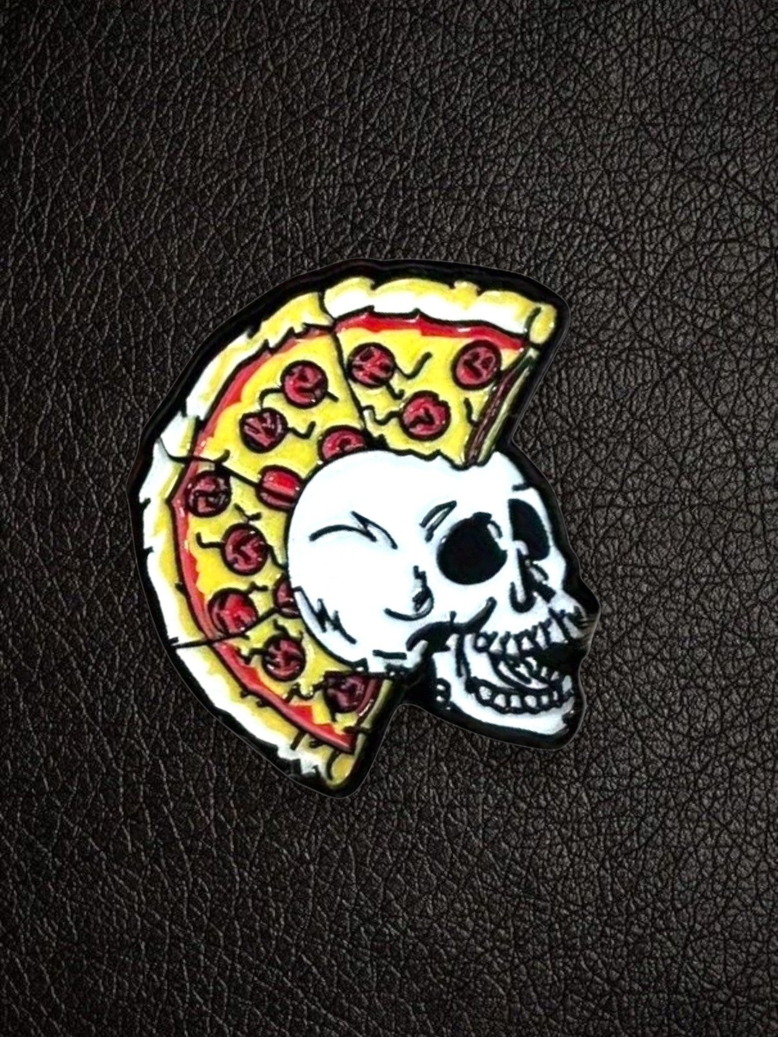 WILDSIDE pizza skull pin with mohawk made of pizza slices, black and white skull with red pepperoni pizza.