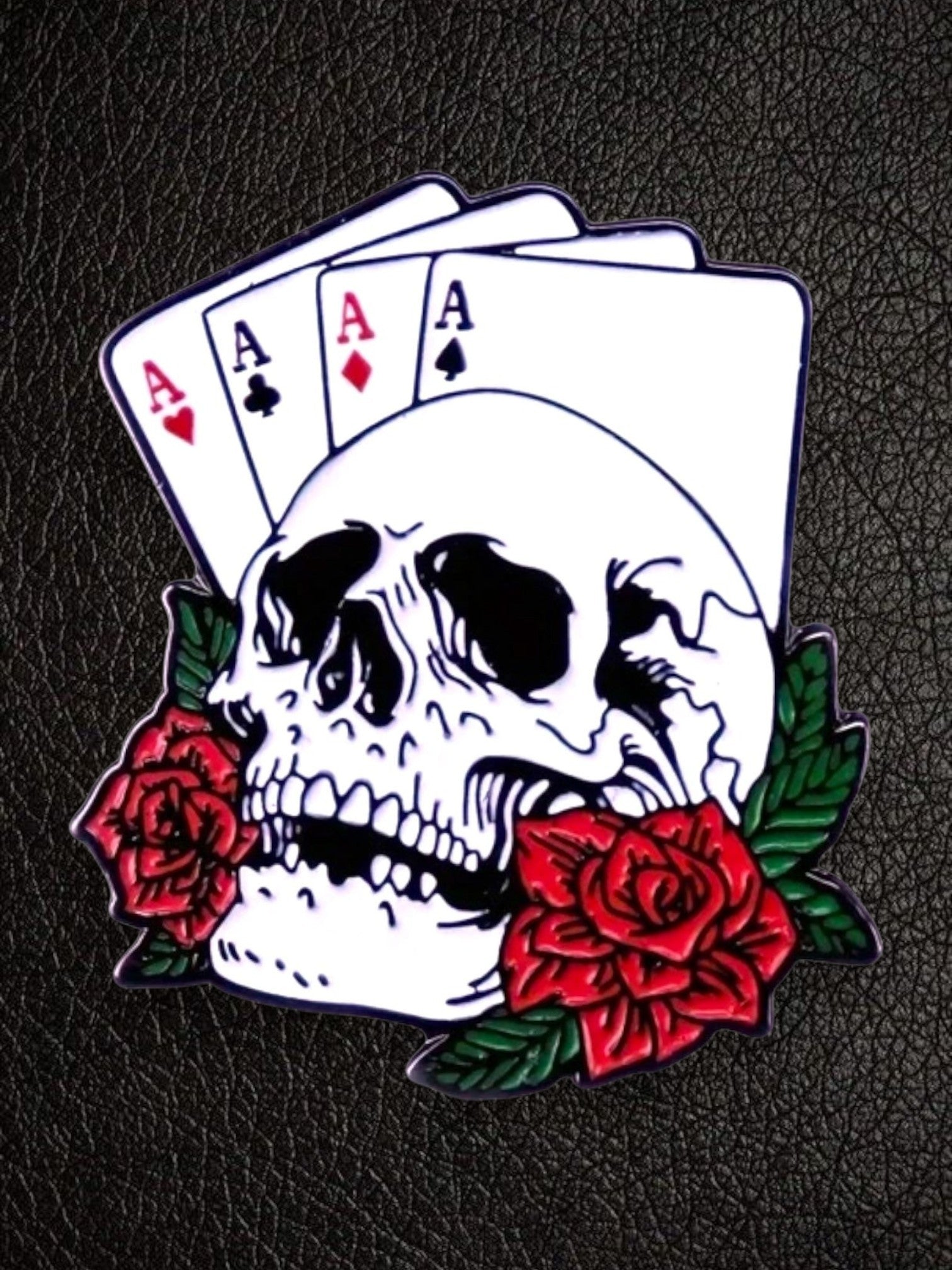WILDSIDE poker skull pin with aces and red roses, enamel accessory for jackets and clothing.