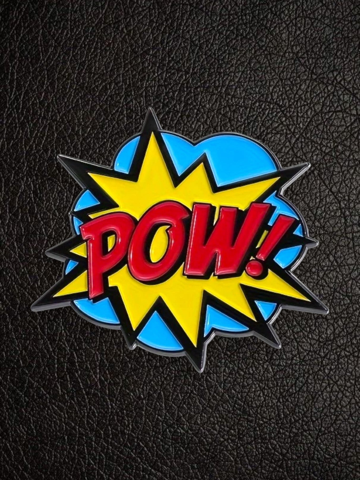 WILDSIDE PopArt POW! enamel pin with red lettering on a yellow starburst and blue speech bubble.
