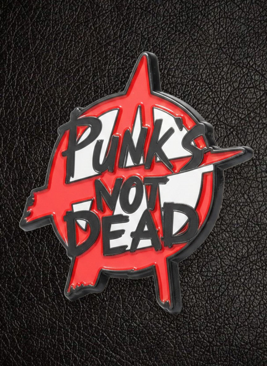 WILDSIDE red and white enamel pin with black outline, featuring the text "PUNK'S NOT DEAD" in a distressed font.
