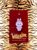 WILDSIDE purple cartoon bunny enamel pin with angry expression and fuzzy trim.