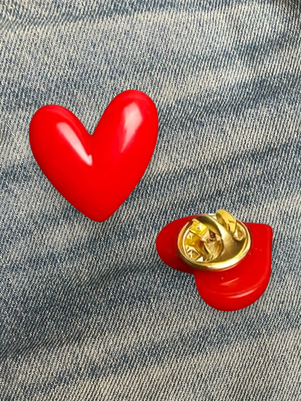 WILDSIDE red heart-shaped enamel pin with gold backing, perfect for jackets and bags.