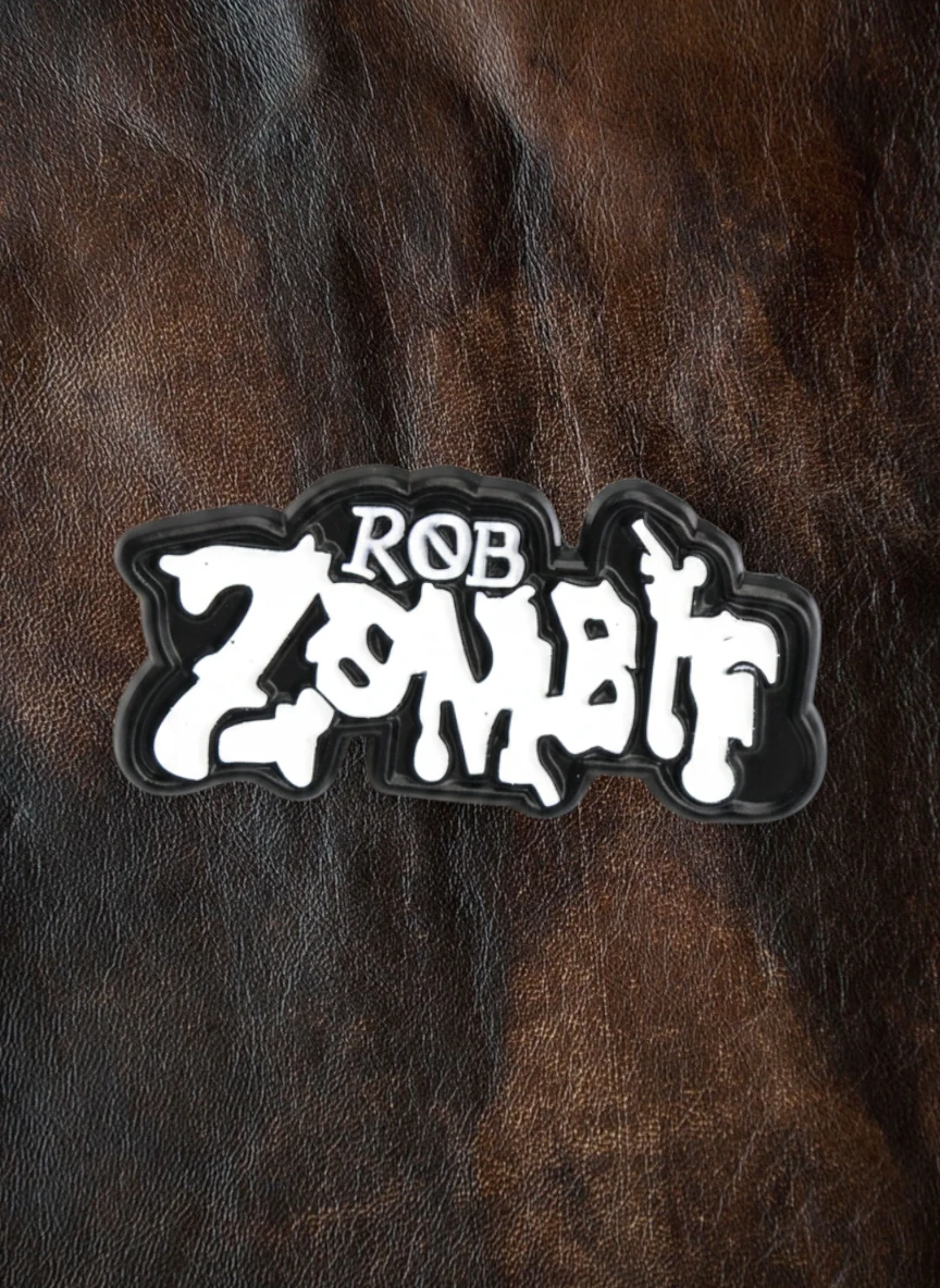 WILDSIDE Rob Zombie logo pin, black and white dripping text design.
