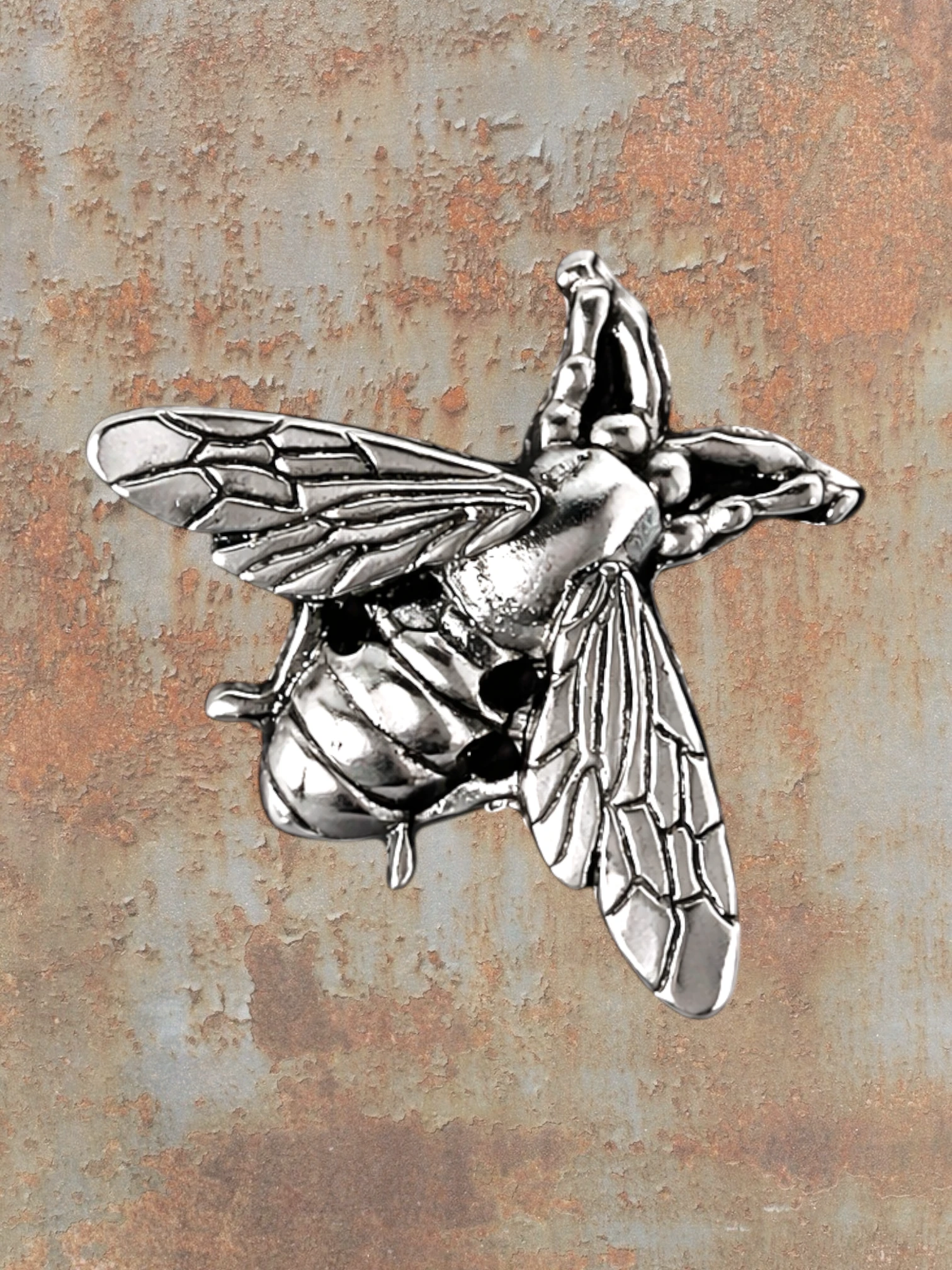 WILDSIDE silver bee pin with detailed wings and body, featuring small black accents.