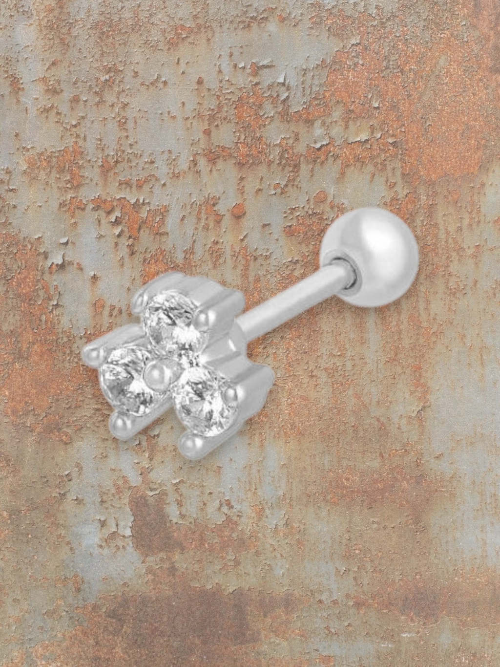 WILDSIDE silver labret piercing with three clear cubic zirconia stones in a clover design and a ball end.