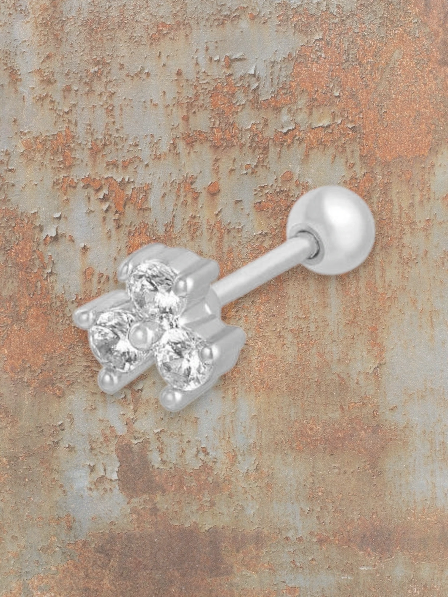 WILDSIDE silver labret piercing with three clear cubic zirconia stones in a clover design and a ball end.