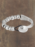 WILDSIDE "Unic" silver plated zamak and black leather bracelet with button clasp, approx 18cm.