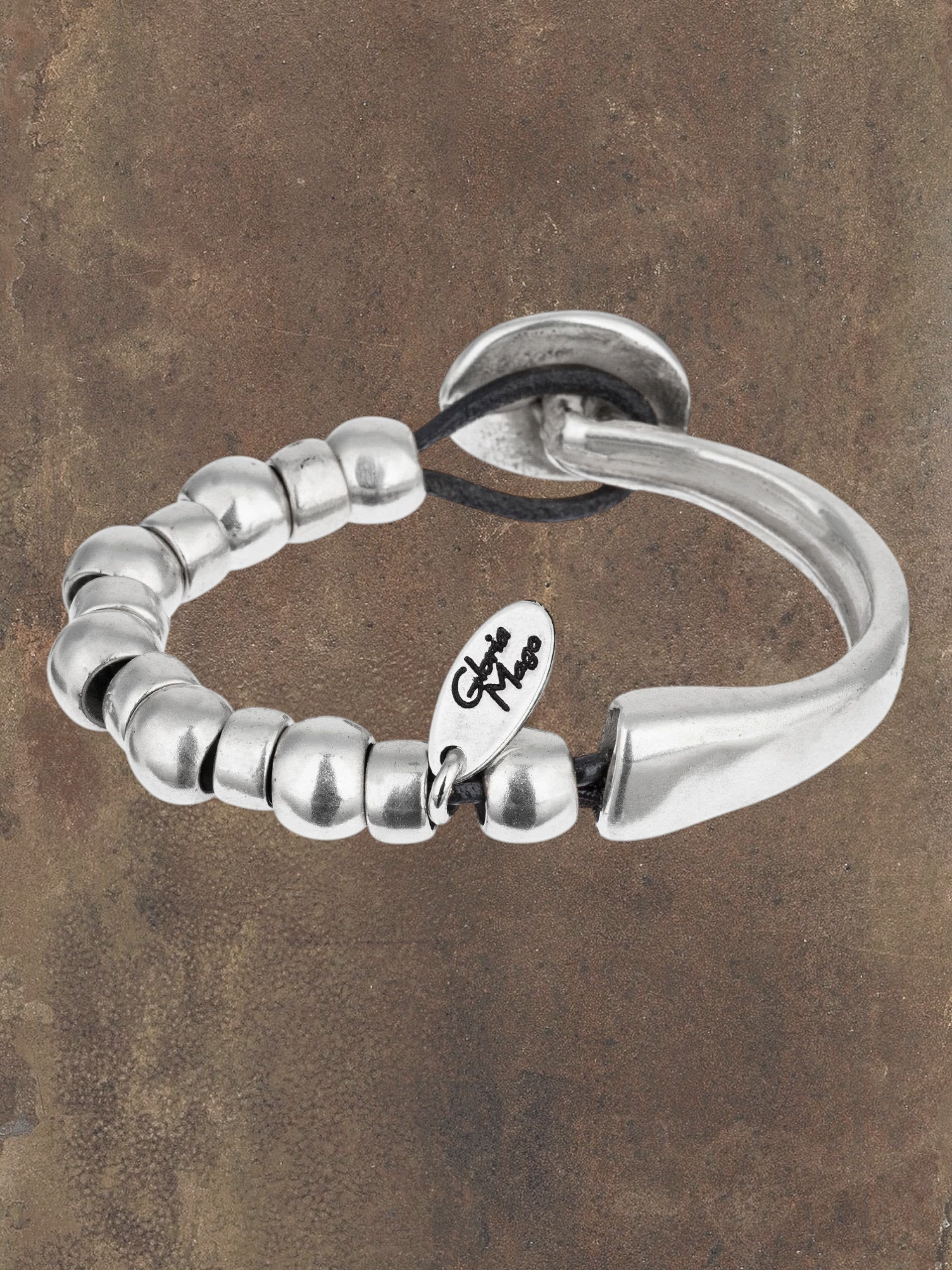 WILDSIDE "Unic" bracelet with silver-plated zamak beads and black leather cord, button clasp.