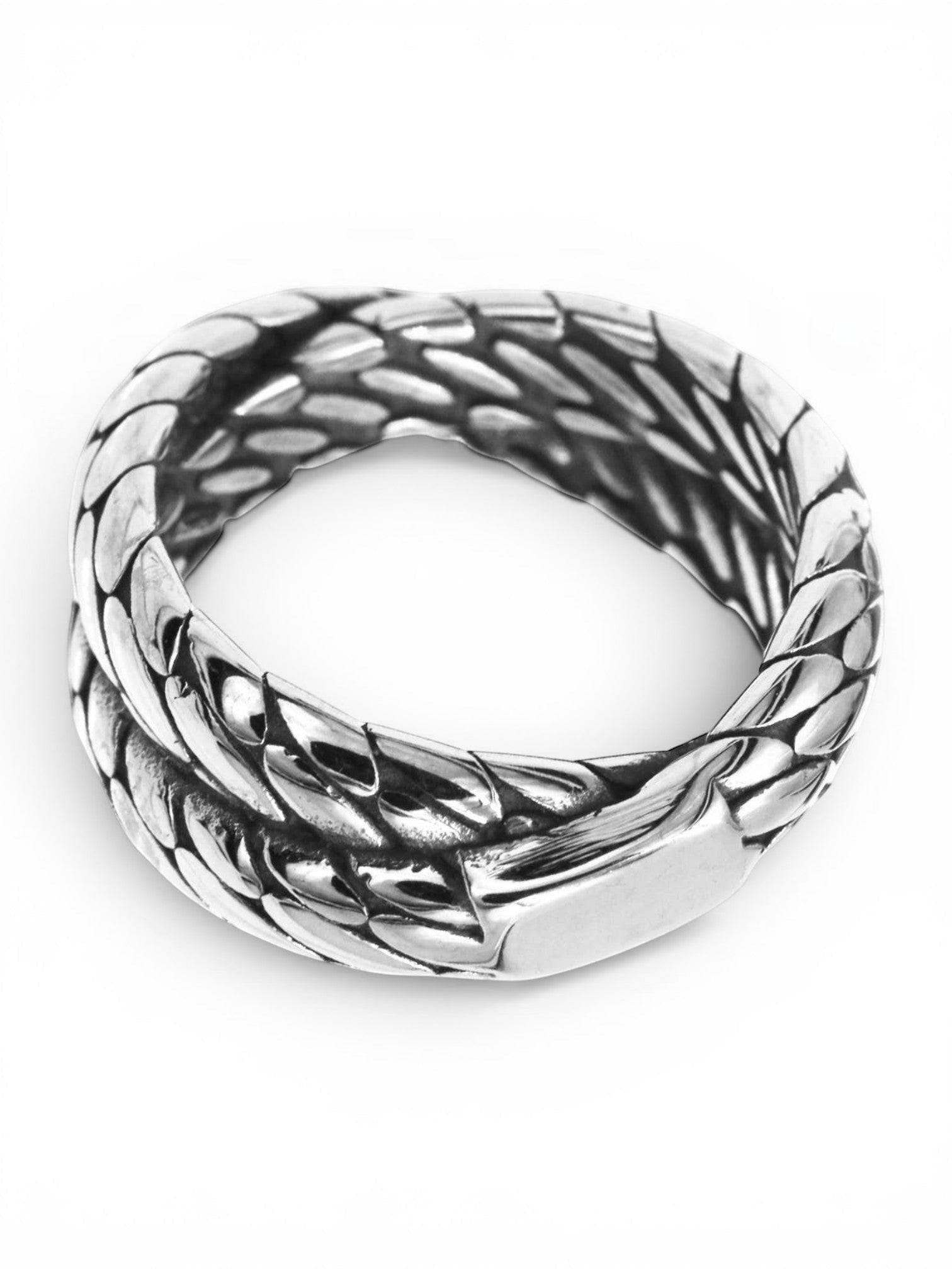 WILDSIDE silver-tone metal band ring featuring an intricate, dimensional scale-like rope texture on a white background.