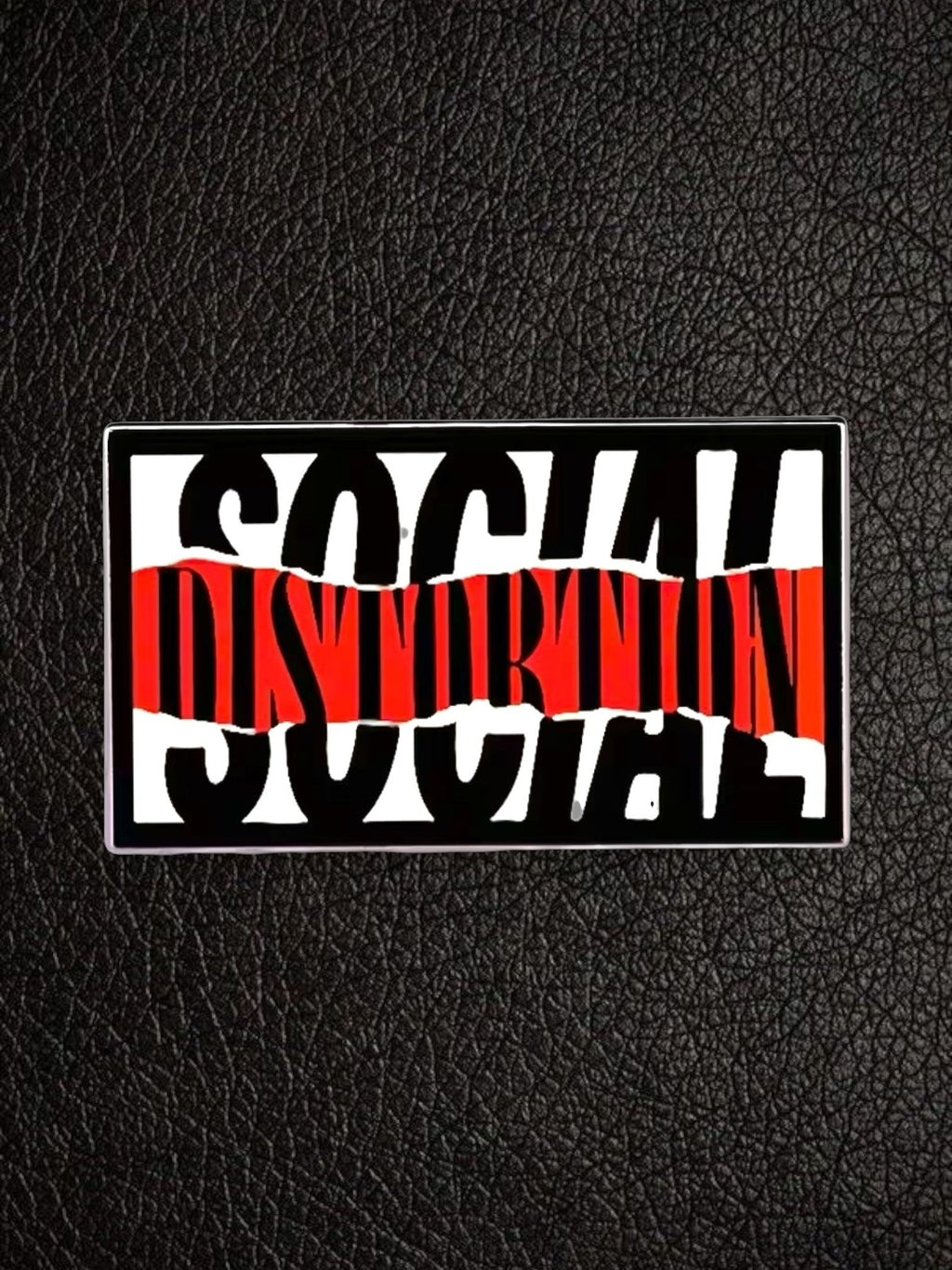 WILDSIDE Social Distortion pin with black and white text over a red distressed stripe.