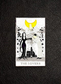 WILDSIDE Tarot The Lovers enamel pin featuring a black-clad figure and a striped-clad figure under a yellow crescent moon.