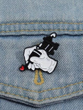 WILDSIDE tattoo gun pin with a red heart, perfect for jackets and clothing.