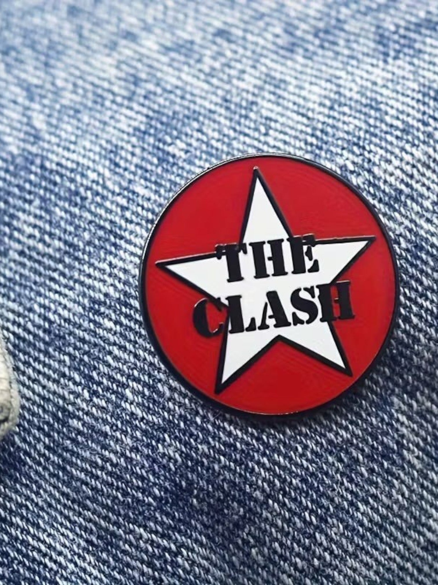 WILDSIDE red enamel pin with white star and black text reading "THE CLASH".