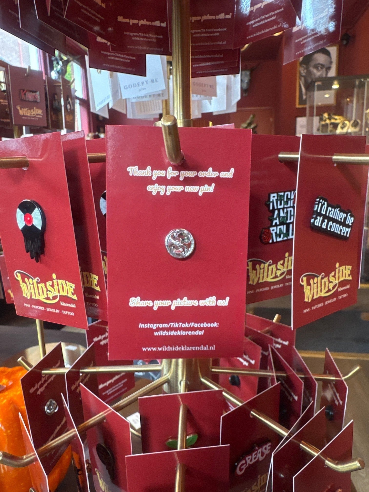 WILDSIDE enamel pin featuring a black vinyl record with a red label, perfect for jackets and bags.