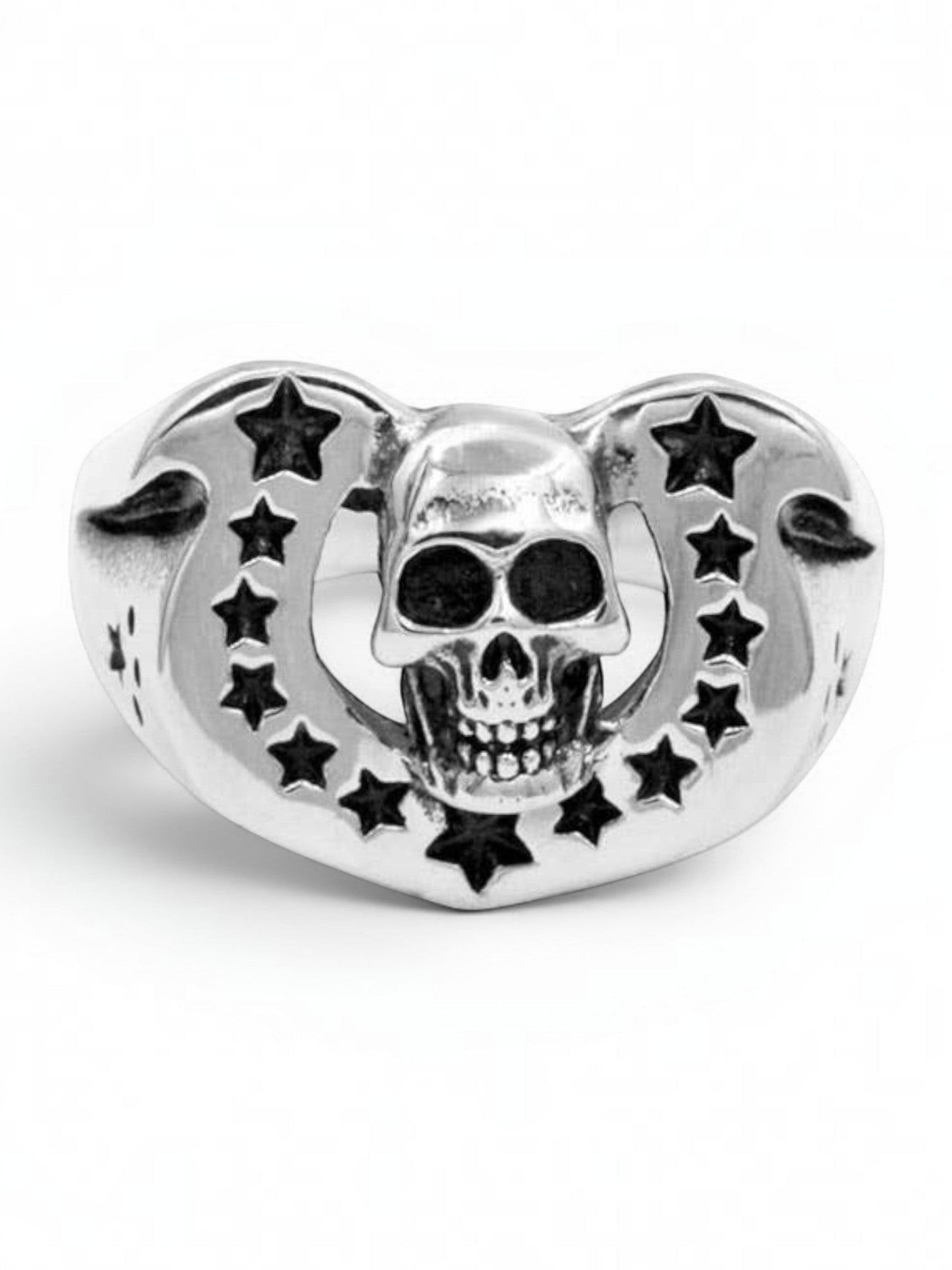 WILDSIDE sterling silver ring featuring a detailed skull emblem framed by a horseshoe arch with star cutouts.