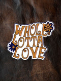 WILDSIDE Whole Lotta Love enamel pin with orange lettering and blue floral accents.