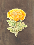 WILDSIDE yellow marigold flower pin with green leaves. Enamel pin for jackets and clothing.