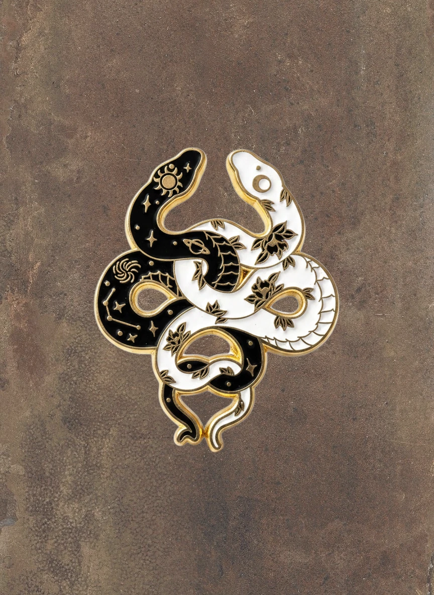 WILDSIDE yin yang snakes pin, black and white enamel with gold trim, celestial and floral details.
